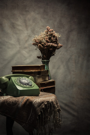 Vintage old phone on the table , still life .の写真素材
