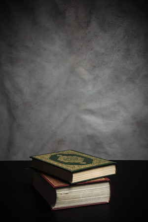 Koran - holy book of Muslims ( public item of all muslims ) on the table , still life .の写真素材