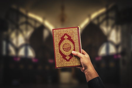 Koran in hand - holy book of Muslims( public item of all muslims )Koran in hand muslims .の写真素材