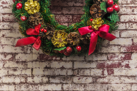 christmas wreath on  brick wall background .の写真素材