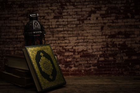 Koran - holy book of Muslims ( public item of all muslims ) on the table , still life  .の写真素材