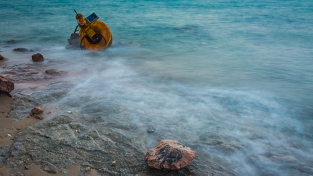 Navigation buoy Aground on the beach .の写真素材