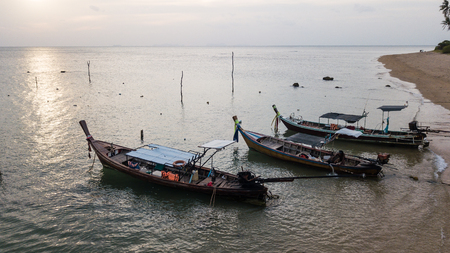 Fishing boat parked on the sea shore. .の写真素材