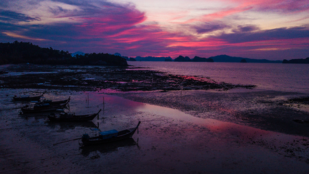 landscape of sunset and fishing boat .