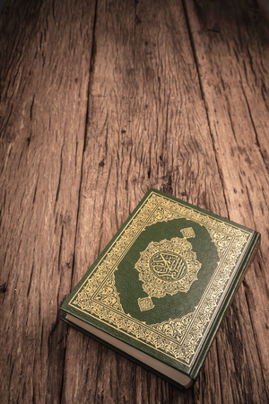 Koran - holy book of Muslims ( public item of all muslims ) on the table , still life  .の写真素材