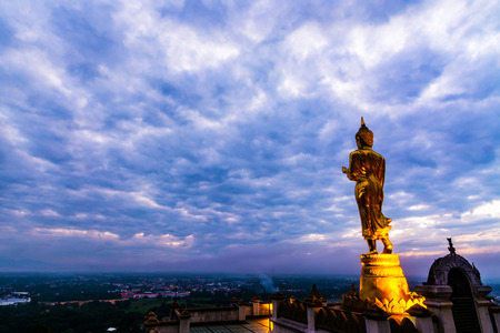 Great Golden Buddha statue at the"Wat Phra That Kao Noi" , Nan province, Thailand  with sky  Twilight time  .の写真素材