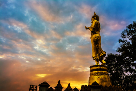 Great Golden Buddha statue at the"Wat Phra That Kao Noi" , Nan province, Thailand  with sky  Twilight time  .の写真素材