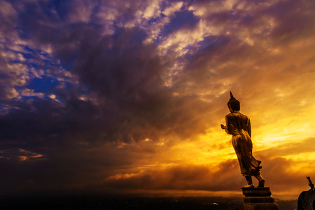 Great Golden Buddha statue at the"Wat Phra That Kao Noi" , Nan province, Thailand  with sky  Twilight time  .の写真素材