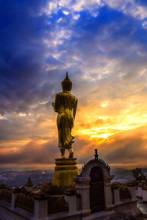 Great Golden Buddha statue at the"Wat Phra That Kao Noi" , Nan province, Thailand  with sky  Twilight time  .の写真素材