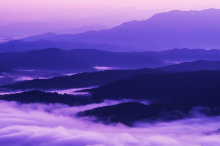sunset overlooking mountains with Mist .の写真素材