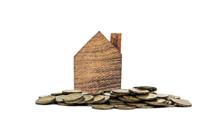 WOOD HOUSE miniature with coin on white background  ,Property concept .の写真素材