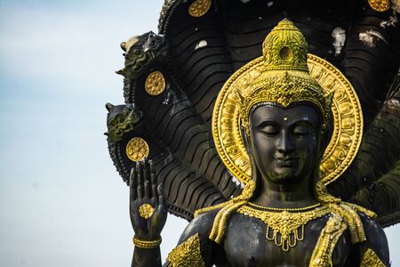 Lord Vishnu statue in a sitting position , Thailand .