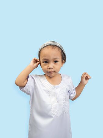 Muslim boy in a dress , isolate backgroundの写真素材