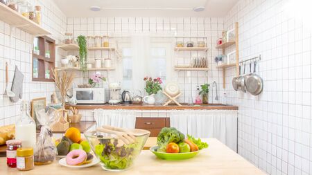 Beautiful  Kitchen Interior with Island, Sink, Cabinets and Pendant Lights in New Home