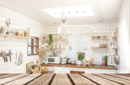 Wood table top on blur kitchen room background .For montage product display or design key visual layout .の写真素材