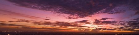 Background of colorful sky concept: Dramatic sunset with twilight color sky and clouds.の写真素材