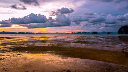 Low tide at the beach  during sunset , Thailandの写真素材