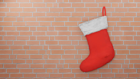 Red Santa sock on Brick wall background , 3D renderの写真素材