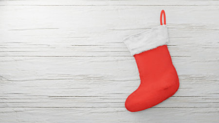 Red Santa sock on wood background , 3D renderの写真素材