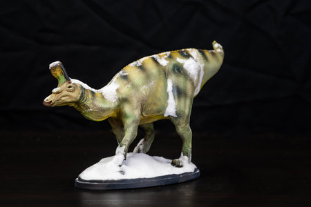 The Tsintaosaurus dinosaur  in the darkの写真素材