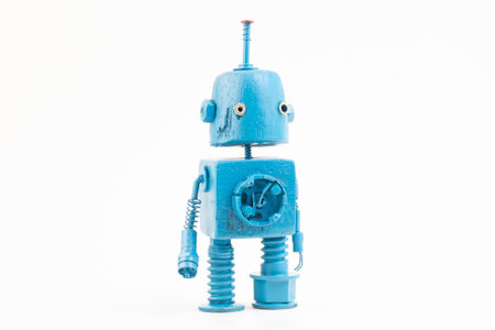 Wooden robot toy on isolated background .