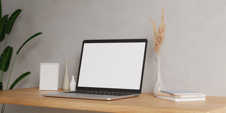 Minimalist workspace with a laptop mockup on a table in a minimal office. 3d render illustrationの写真素材