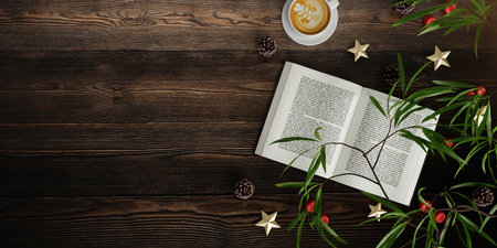 Holiday reading setup with coffee and greenery, rustic table, 3D render.の写真素材
