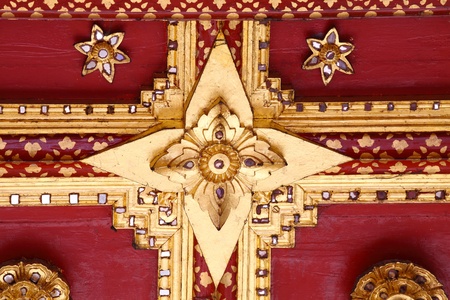 Thai Golden Carving Flower on Temple Roofの写真素材