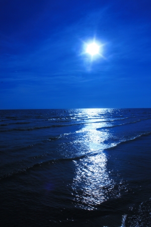 Blue Sun siluate witch Seasideの写真素材