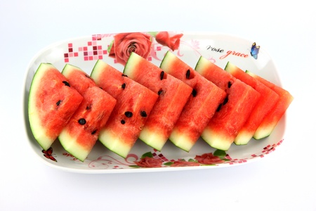 The Focus watermelon on white background, sliced into on dish.の写真素材