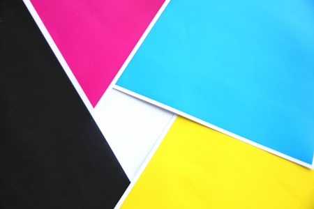 Five colors sheets of paper stacked atop to the new image Rams into squares.の写真素材