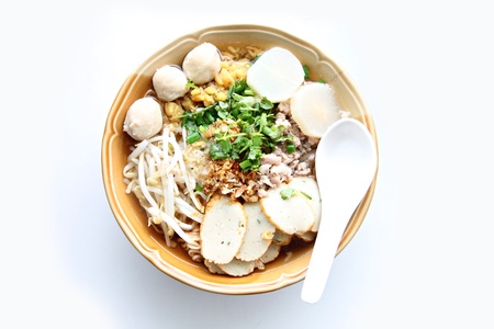 Thai Noodles soup in bowl on white background.