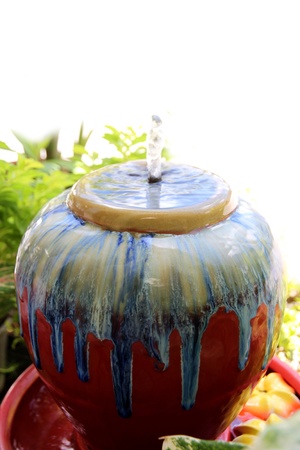 A small fountain in the garden.の写真素材