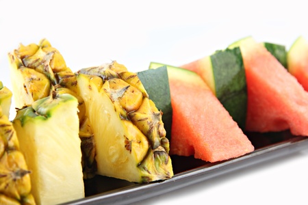 Picture closeup Pineapple and Watermelon slice Arranged in the black dish の写真素材