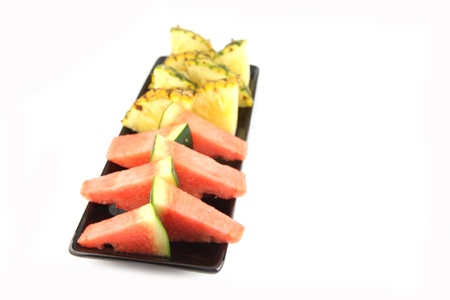 Picture closeup Pineapple and Watermelon slice Arranged in the black dish の写真素材