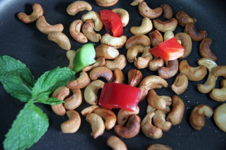 Focus Cashew nuts and bell pepper in pan.の写真素材