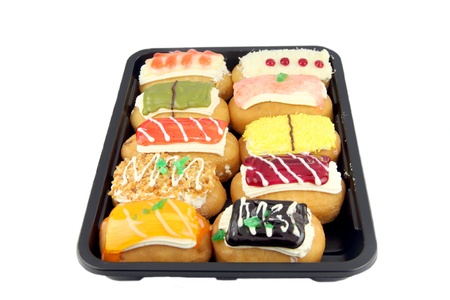 Sushi color Donuts in the black dish on white background の写真素材
