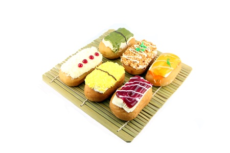 Closeup Mix Sushi Donuts in the bamboo dish on white background.