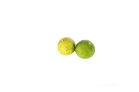 Focus The Green lemon and slice on white background.