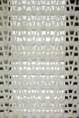 Closeup The Picture Patterns of white plastic with a conveyor belt.の写真素材