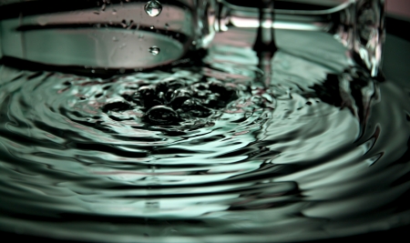 Closeup Pictures Pour water into the basin and water splash beautiful shape.の写真素材