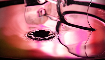 Closeup Pictures Red color and glass Background of Water drops a beautiful shape in Basin.の写真素材