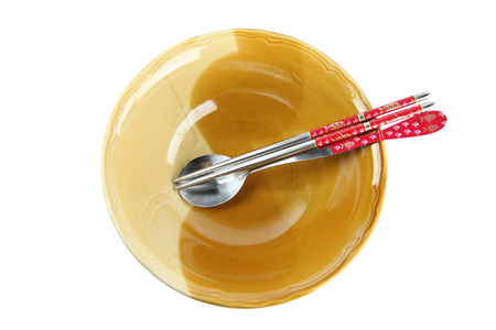 Eating Accessories of spoon,chopsticks and bowl on white background.の写真素材