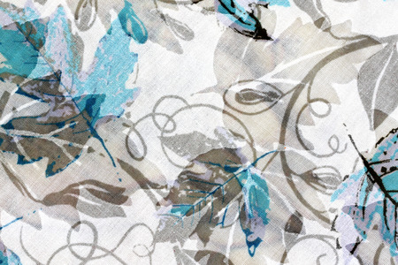 The Pattern of flowers and leaves on the shirt.