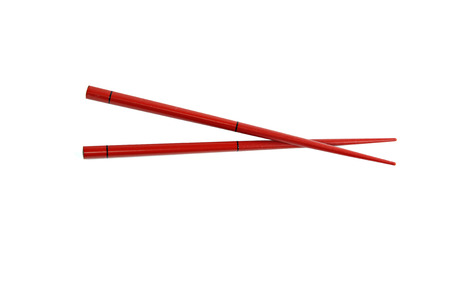 Red chopsticks isolated on white background.の写真素材