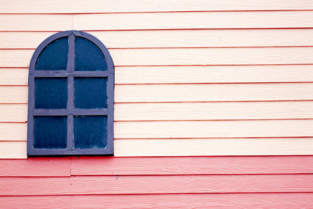 Window on the wooden wall for background.の写真素材