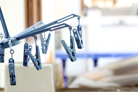 the clothes peg on washing line in house.の写真素材