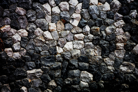 Dark color of stone wall in house for the background.の写真素材
