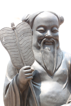 Chinese deity statues on white .の写真素材