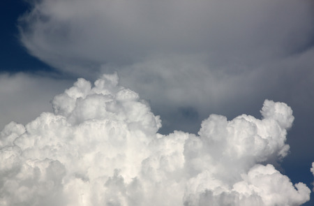 The partly cloudy on black sky to before going to rain.